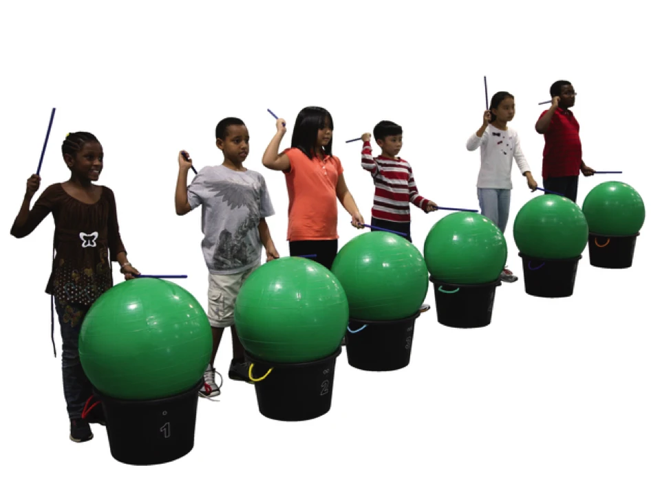 kids drumming on stability balls