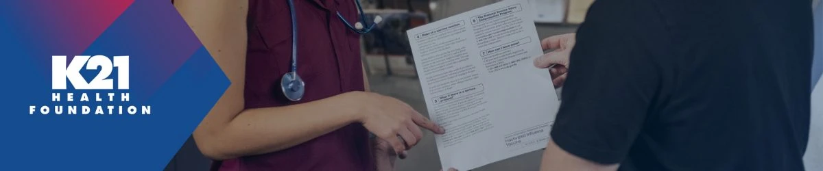 doctor and patient looking at paper