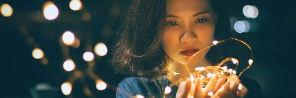 girl looking at glowing lights